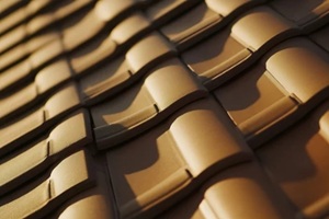 roofing contractor replacing a damaged roof tile