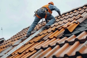 worker inspecting roof damage