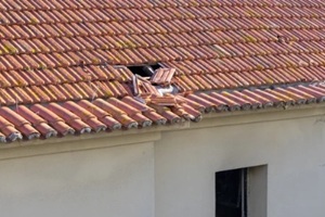 broken roof tiles showing damage from storm or neglecting maintenance