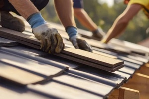 Roofing contractor replacing roof tiles