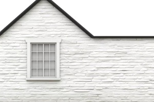 white brick wall with gable roof and single-pane window