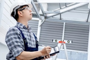 roof replacement inspector assessing roof of Northern VA home