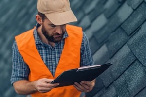 roof inspector checking roof