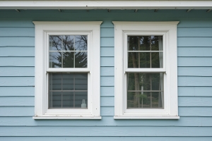 Two Vinyl Windows on Exterior Wall of A Vintage House